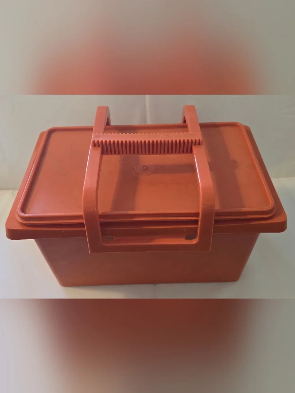 Vintage Tupperware Carry-All Storage Container in the classic orange